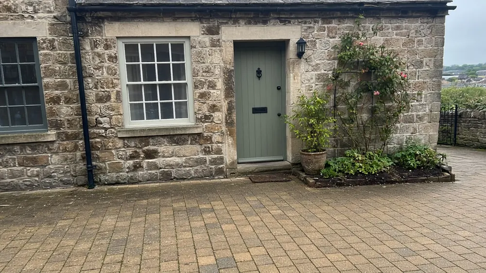 Example image: a brindle block paved driveway at a stone cottage